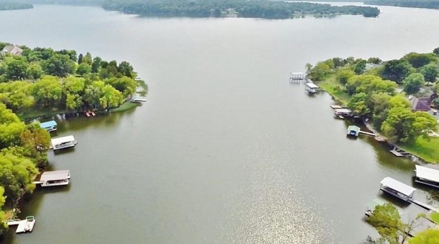 About Our Agency - Cumberland River Seen From Above, Trees on Each Bank, the Sky Hazy